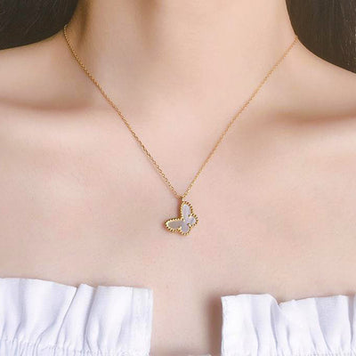 woman wearing 18K gold plated dainty butterfly pearl seashell 925 sterling silver necklace