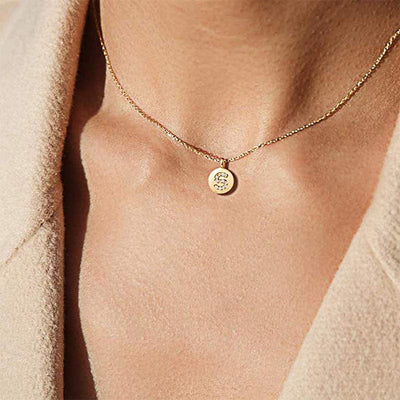 woman wearing gold plated sterling silver nolo letter pendant initial dainty necklace