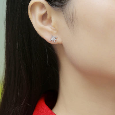 woman wearing nolo north star moissanite cubic zirconia sterling silver rhodium stud earrings