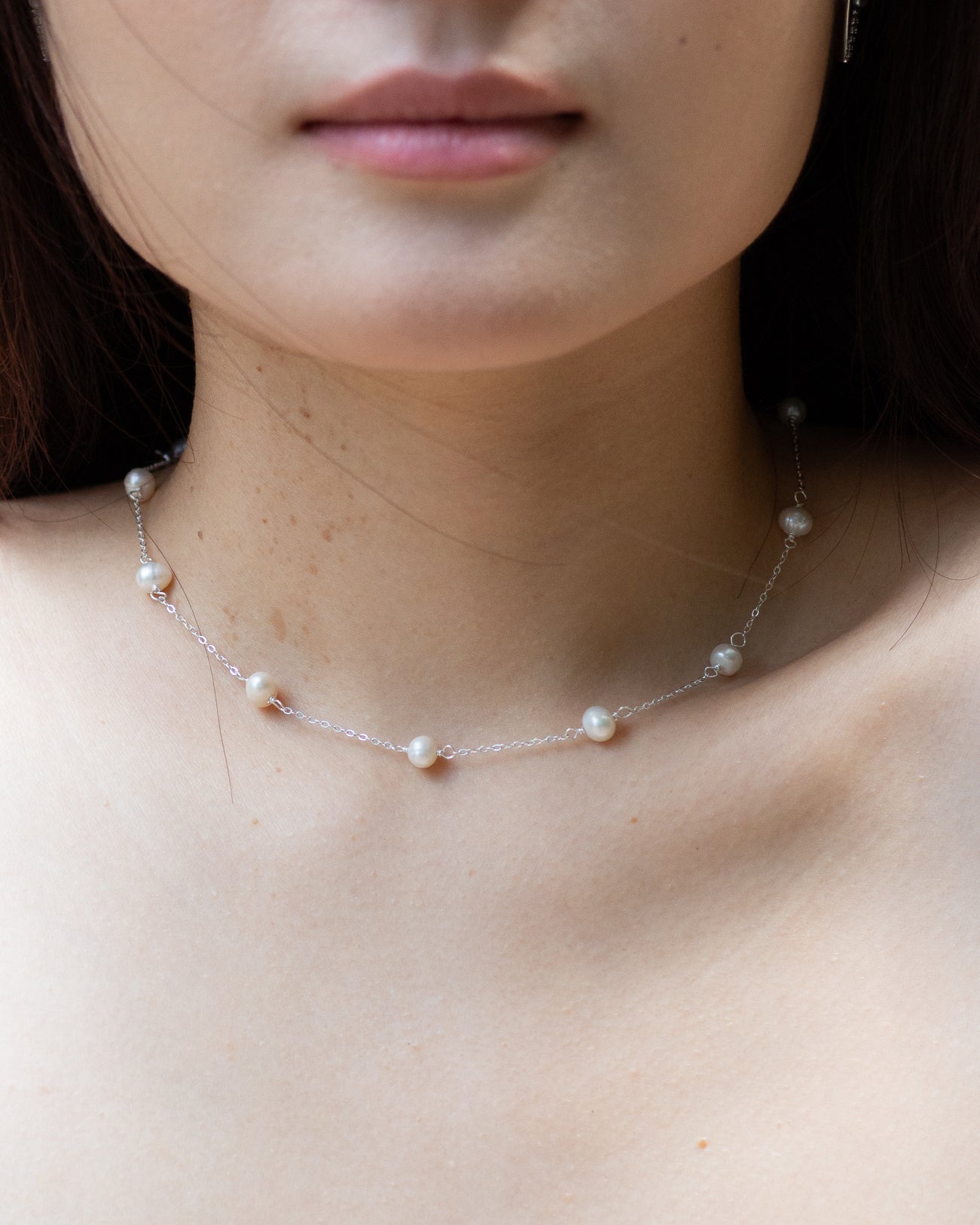 Yumei wearing classic pearl choker dainty sterling silver necklace