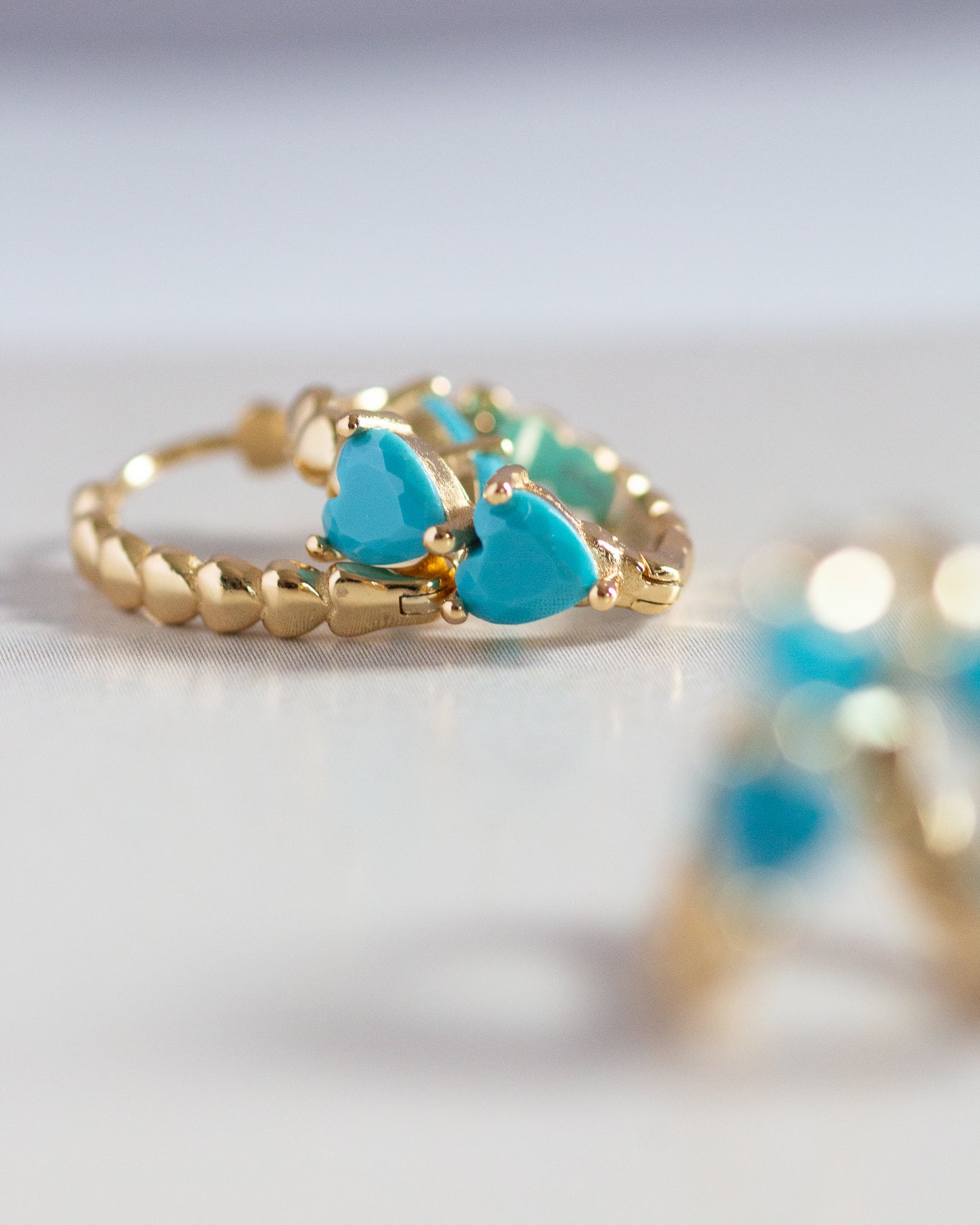 N O L O - Candy Colored Turquoise Double Heart Huggie Earrings