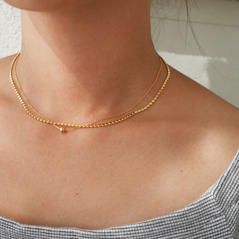 woman wearing double layer double style two piece 2pc dainty choker gold bead chain link necklace