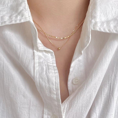 woman wearing double layer double style two piece 2pc dainty choker gold bead chain link necklace
