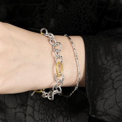 woman wearing nolo branch link silver thin artsy unique bracelet
