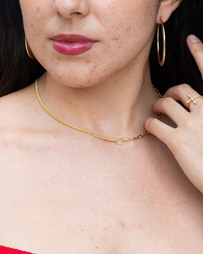 woman wearing nolo half and half paperclip and cuban link gold plated sterling silver splicing necklace