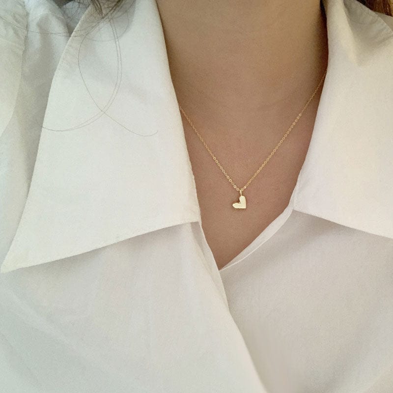woman wearing nolo origami geometric angular cute dainty tiny small 18k gold plated sterling silver heart necklace