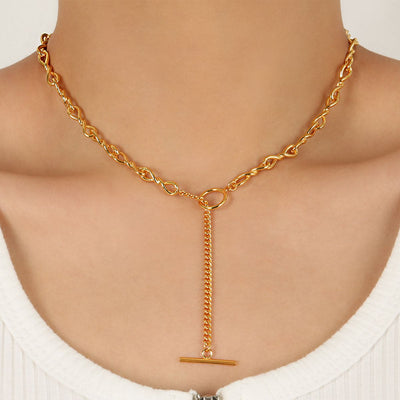 woman wearing nolo rich OT toggle clasp lariat style choker gold plated sterling silver spiral twist chain drop necklace