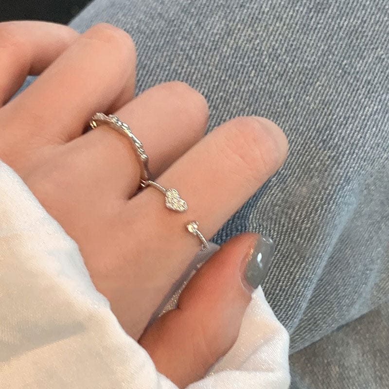 woman wearing nolo super cute dainty thin spiral adjustable open band 925 sterling silver heart cubic zirconia gemstone ring