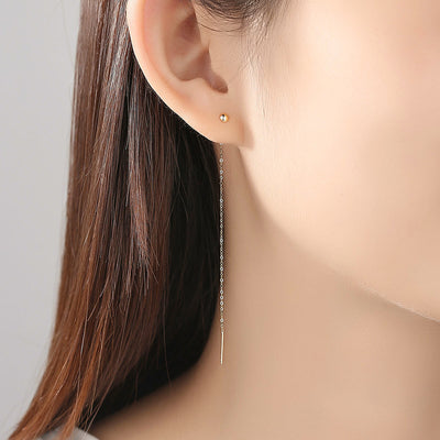 Woman Wearing 18K Gold Thin Long Linear Bar Dangle Drop Cable Link Earrings