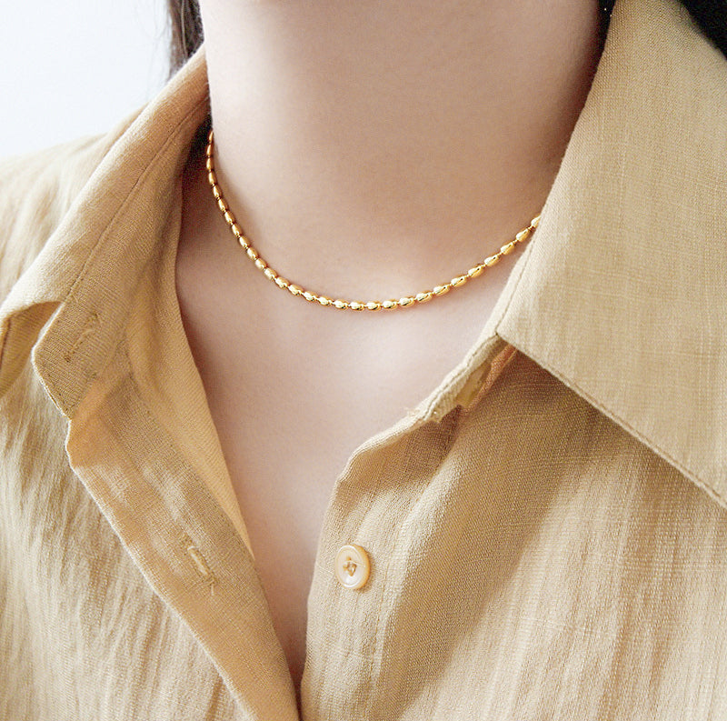 Woman Wearing Large Ball Chain Beaded Pelline Clavicle Necklace In Gold Plated Sterling Silver