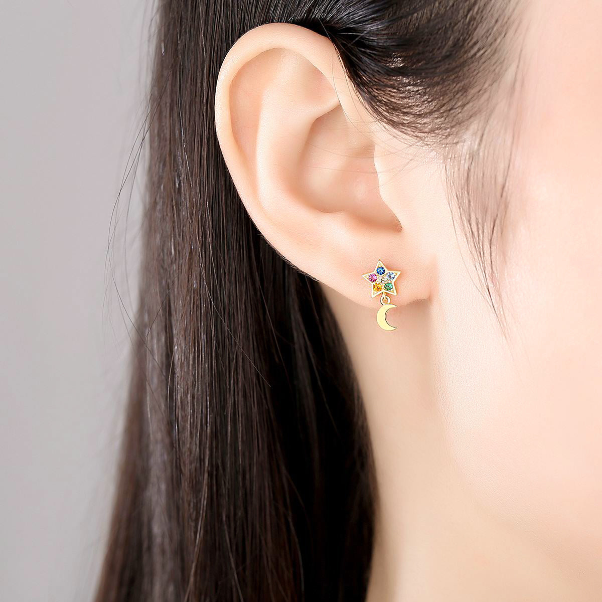 Woman Wearing Multi Colored Colorful Candy Moon And Star Mismatched Cubic Zirconia Earrings In 18K Gold Plated 925 Sterling Silver