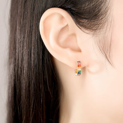 Woman Wearing Multi Colored Colorful Candy Small Open Huggie Hoop Cubic Zirconia Earrings In 18K Gold Plated 925 Sterling Silver
