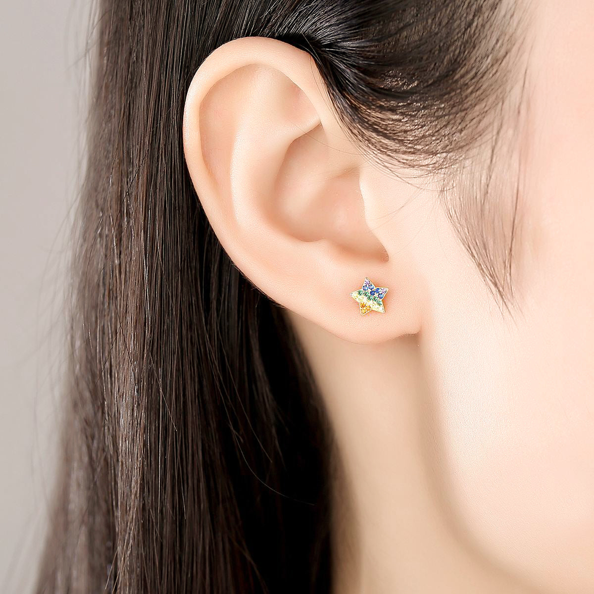 Woman Wearing Multi Colored Colorful Star Candy Cubic Zirzonia Stud Earrings In 18K Gold Plated 925 Sterling Silver