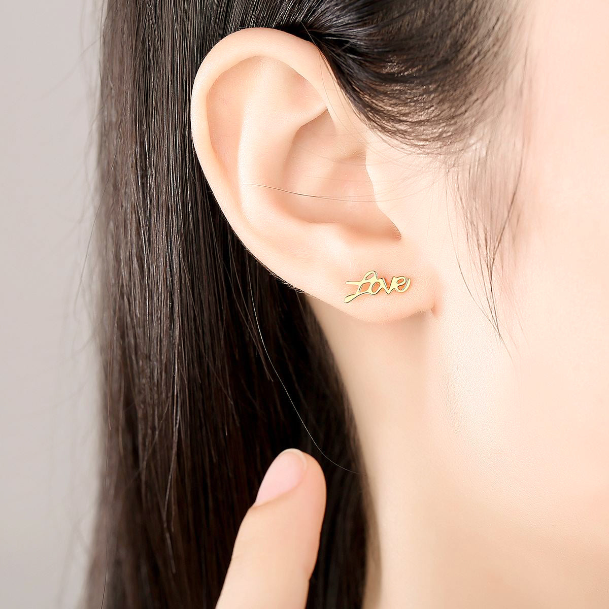 Woman Wearing Love  Stud Mismatched Earrings In 18K Gold Plated 925 Sterling Silver