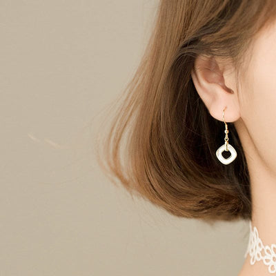Woman Wearing Pearl Shell And 18K Gold Plated Sterling Silver Geometric Open Circle Drop Earrings