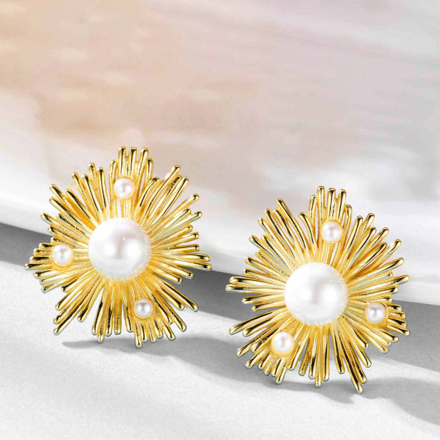 woman wearing sunflower shell pearl 18k yellow gold plated 925 sterling silver earrings