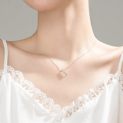 woman wearing clever dainty envelope letter 925 sterling silver cubic zirconia necklace