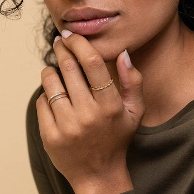 woman wearing gemstone stacker 6 degrees 14k gold plated sterling silver thin stackable ring