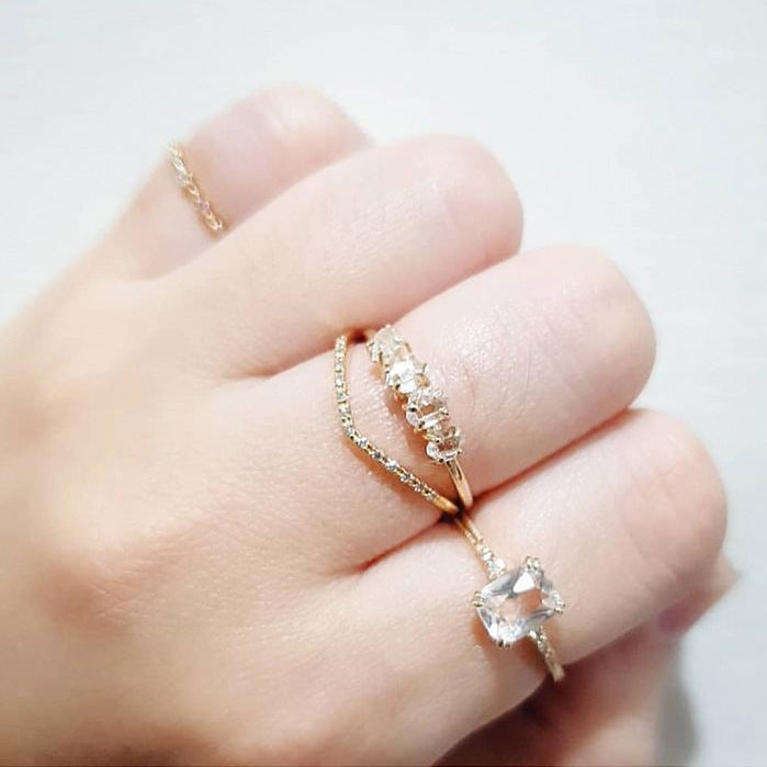 woman wearing natural crystal stackable 14k gold plated engagement style ring