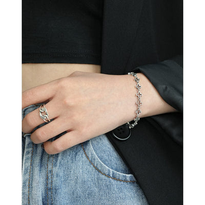woman wearing nolo celtic vintage style hollow link sterling silver chain cross bracelet