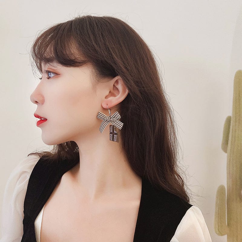 woman wearing nolo choco late fashion bow tie creative cute party japanese korean style chocolate bar earrings