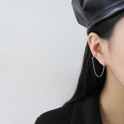 woman wearing nolo detachable connector connected sterling silver huggie chain earrings