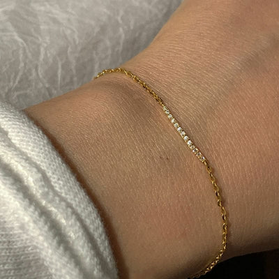 woman wearing nolo double layer 18k gold plated sterling silver cubic zirconia bracelet