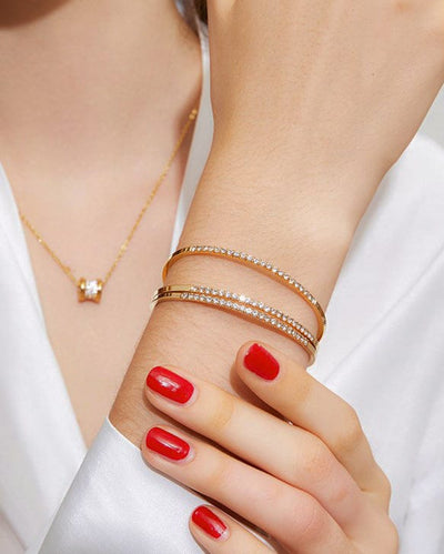 woman-wearing-nolo-fairy-gold-stackable-3-piece-sterling-silver-bracelet