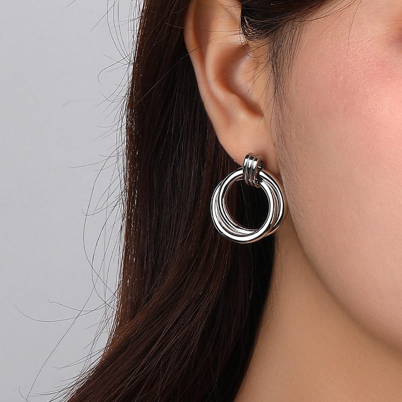 woman wearing nolo two circles double loop sterling silver bold earrings