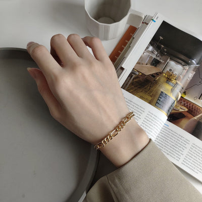 woman wearing nolo your figaro 18k gold plated sterling silver chain bracelet