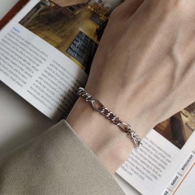 woman wearing nolo your figaro white gold plated sterling silver chain bracelet