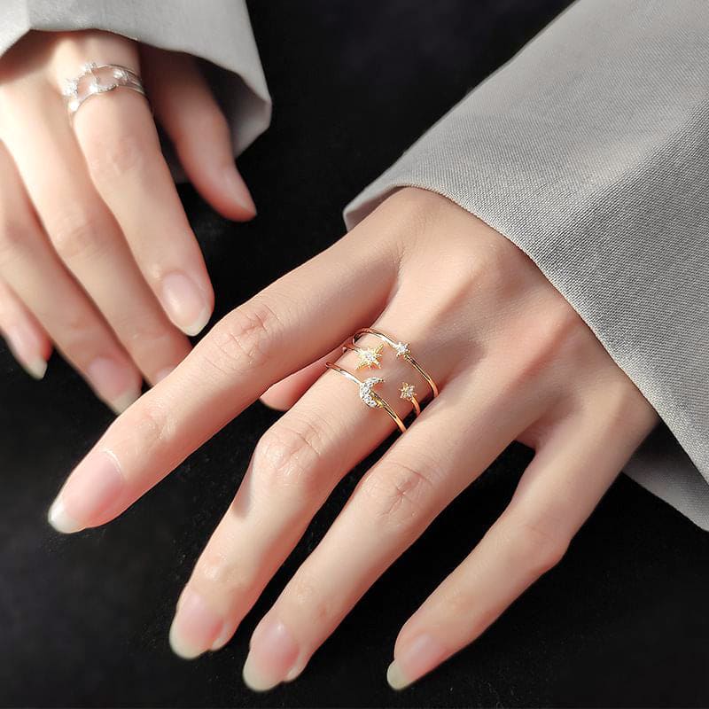 woman wearing triple layered moon and star 18k gold plated sterling silver zirconia adjustable ring