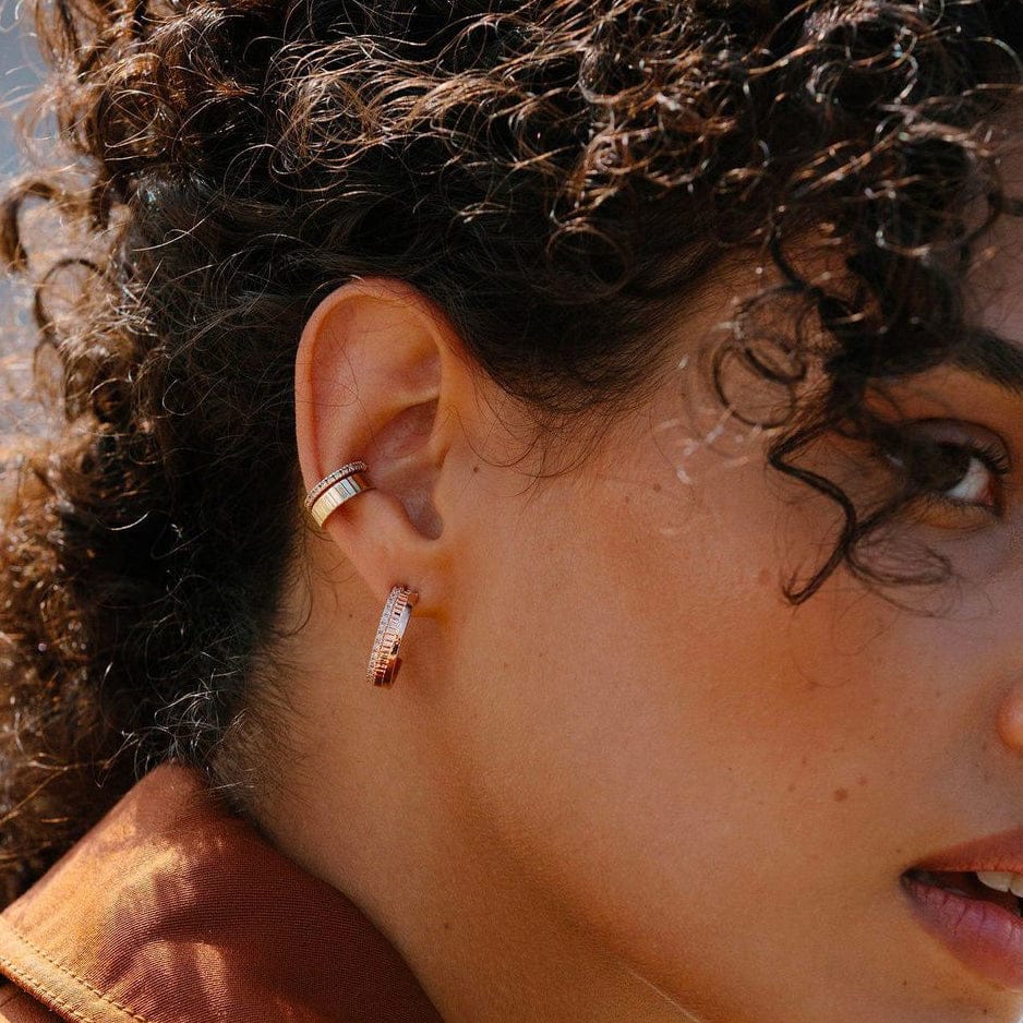 woman wearing stairway of hope 14k gold plated sterling silver open hoop zirconia earrings